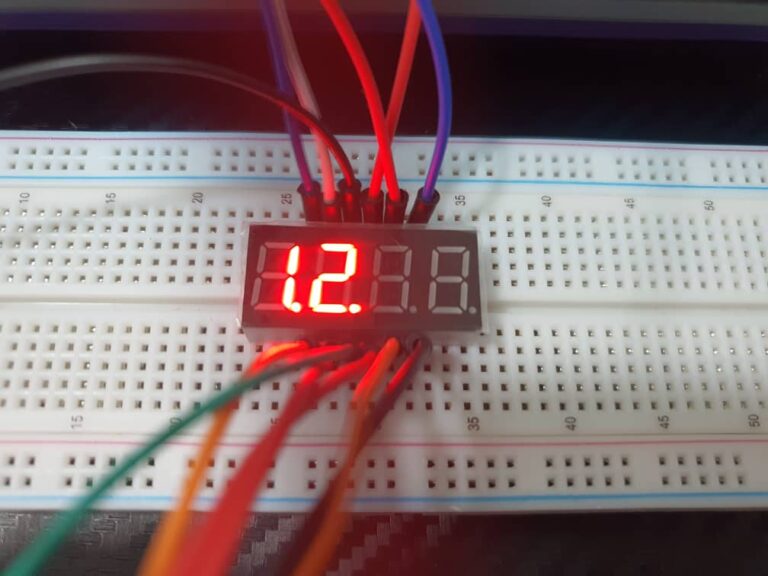 How does a 4-digit 7-segment LED display operate?